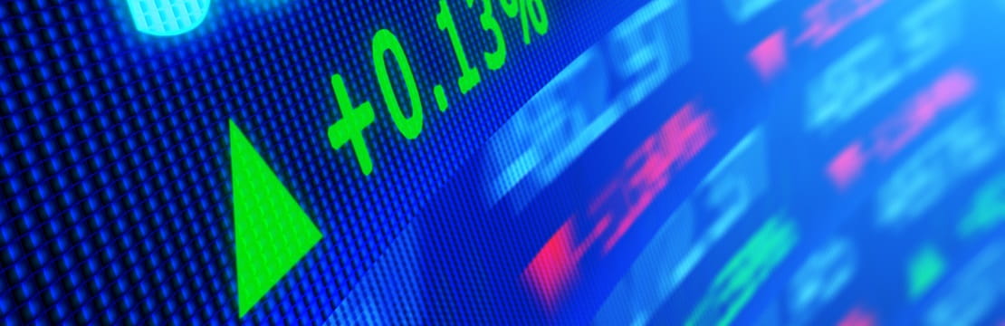 Side angle view of stock market data on video display board